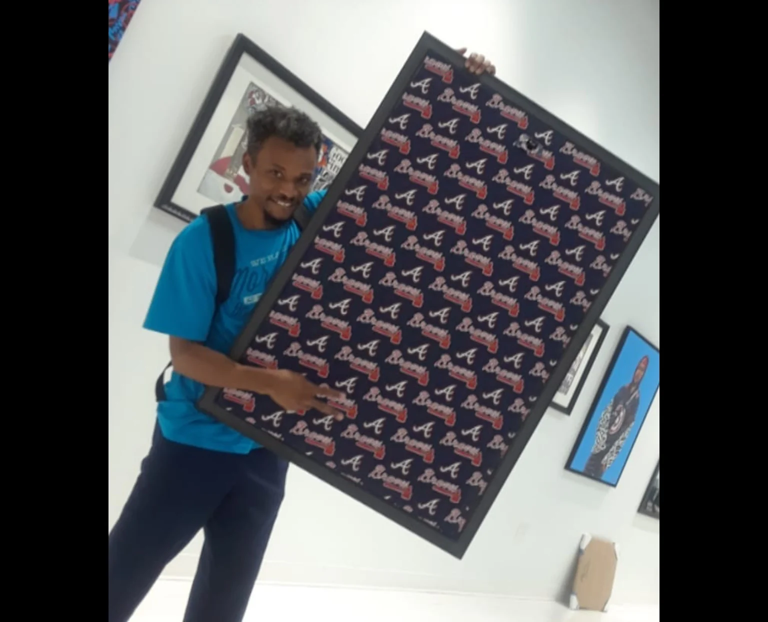ARTIST53 showing the custom backing of the Atlanta Brave framed artwork