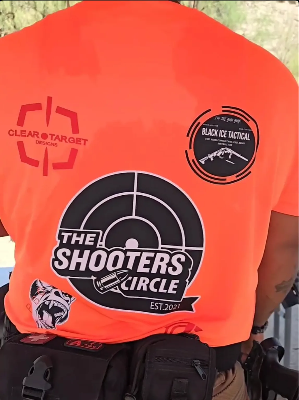 Shooters Circle logo printed on orange event shirt