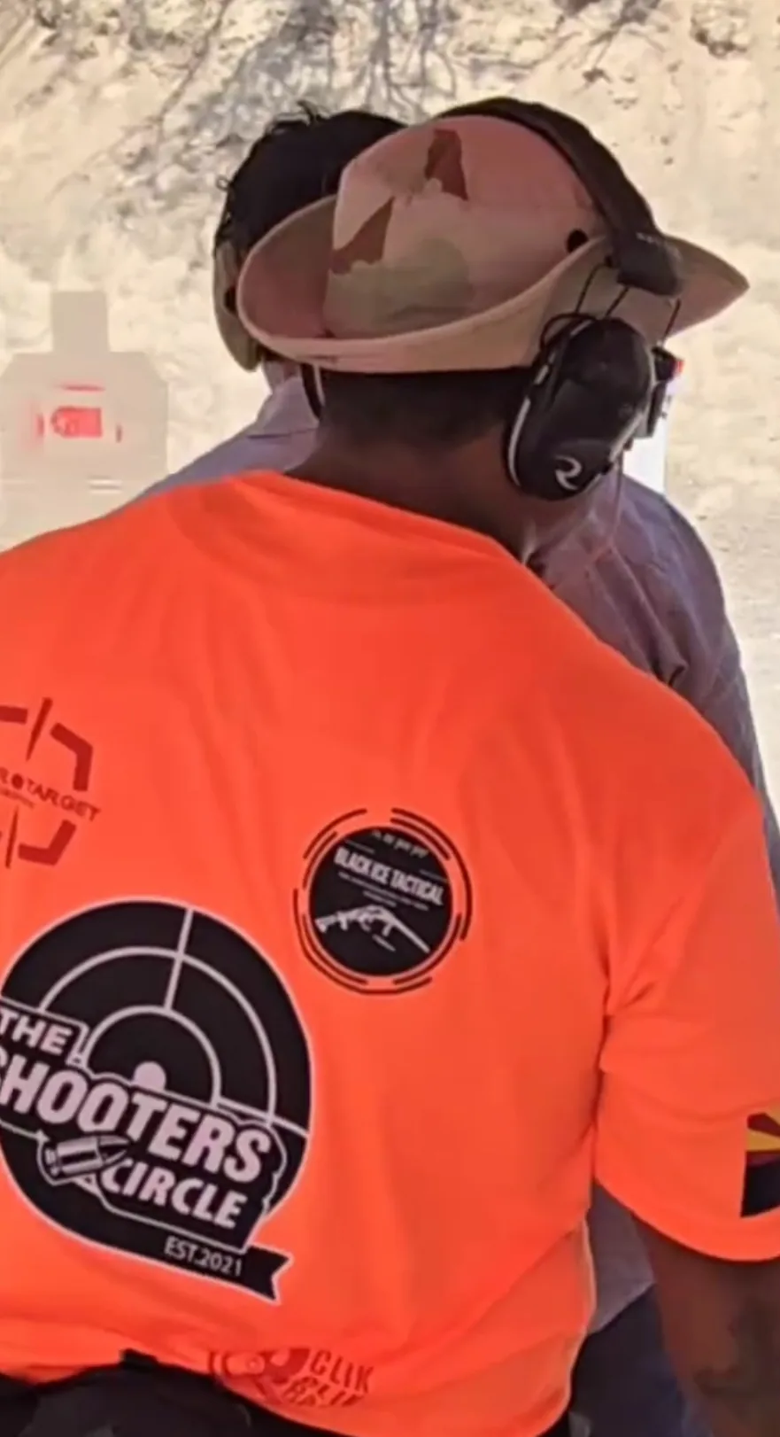 Shooters Circle branded shirt in use at a shooting event